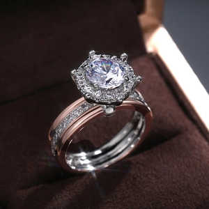 Macro shot of a two-tone halo bridal ring set with sparkling round cubic zirconia stones