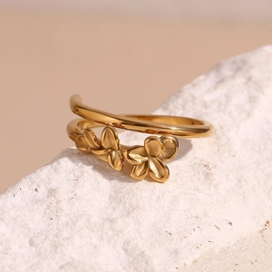 Macro detail of 18K gold plated double layer ring featuring 3D floral design elements