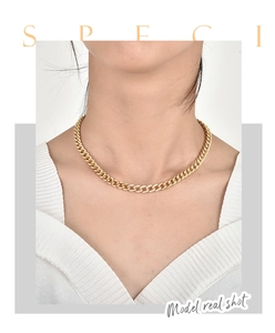 Close-up of 18K gold plated Cuban chain necklace with sparkling pave set zircons