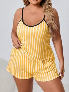 Detail of yellow and white striped pajama set with thin straps and black trim