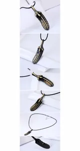 Dettaglio macro del ciondolo a piuma e artiglio in bronzo su cordino nero