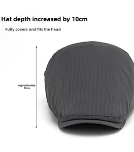 Detail view of dark grey striped beret hat showing 10cm depth for comfortable head fit