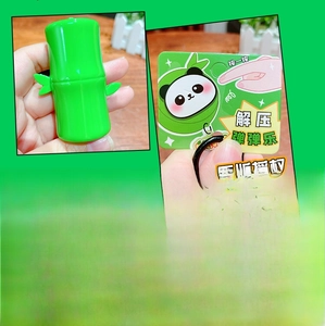 Close-up of cute green bamboo stress relief toy made of smooth soft silicone material