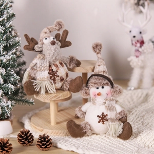 Knitted Christmas plush set with reindeer and snowman figures in warm beige earth tones