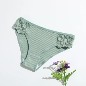 Light green cotton ribbed underwear for women featuring delicate lace trim on white background