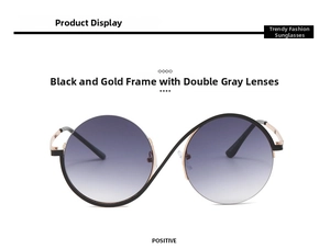 Detail of black gold round semi-rimless glasses with gradient grey lenses and S-shaped curve