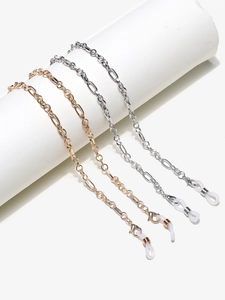 Detail of Figaro style eyewear chains in gold and silver with adjustable rubber loops