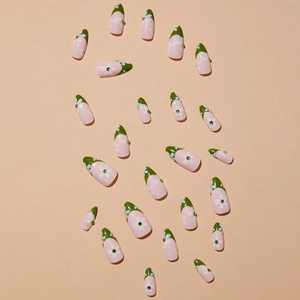 Pink press-on nails with green French tips and small white flower accents with rhinestones