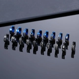 Detail view of assorted stainless steel hoop earrings in black and blue finishes