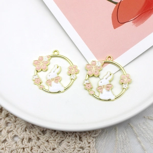 Detailed macro view of a gold-plated cherry blossom rabbit charm for DIY jewelry