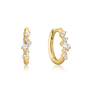 Close-up of gold hoop earrings featuring emerald cut and round cubic zirconia stones