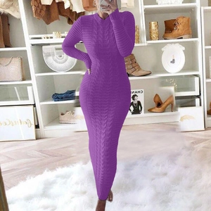 Detailed view of purple cable knit long sleeve sweater dress with textured pattern