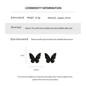 Detail view of black hollow butterfly earrings with dimensions 3cm height and 2.8cm width
