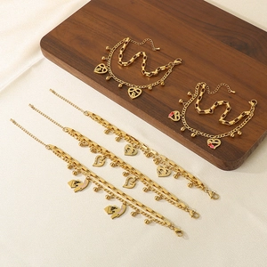 Golden double-layered stainless steel bracelet with hollow heart charms for women