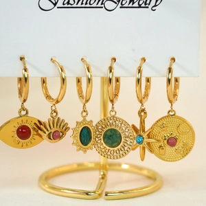 Bohemian 6-piece gold earring set with colorful evil eye and star pendants on white card