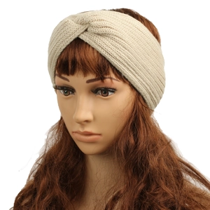 Detail of beige fleece-lined knitted headband with a cross-knot twist design