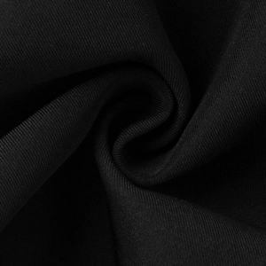 Macro shot of high-quality black twill fabric texture on a lace-spliced blazer coat