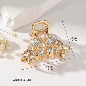 Elegant gold butterfly hair claw clip with rhinestones shown with clear size measurements