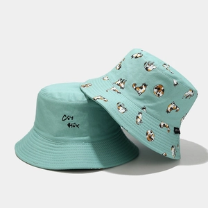 Detail of mint green bucket hat featuring cute cat embroidery and cat print patterns