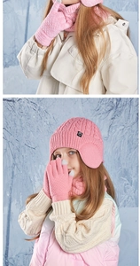 Detail of pink knitted winter set with fleece-lined hat, scarf, and gloves for kids