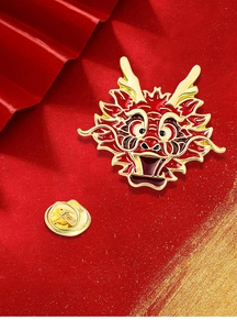 Detail of a Chinese dragon enamel brooch with gold frame and butterfly clutch on red