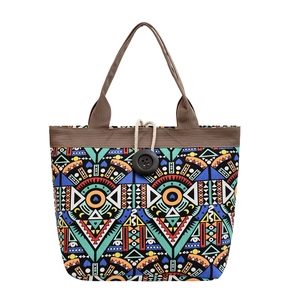Ethnic bohemian canvas tote bag with geometric patterns and wooden button closure