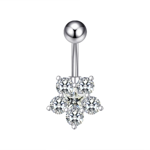 Macro shot of silver belly ring with star shaped flower zircon pendant on white background
