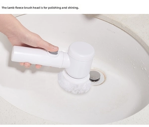 Detail of handheld electric cleaning brush with soft wool pad for sink polishing