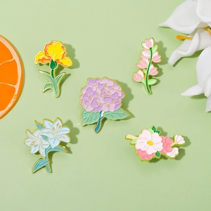 Five-piece set of elegant enamel floral brooches featuring lily and violet floral designs