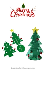Detail of mini acrylic Christmas tree with stars and ornaments for tabletop DIY decoration