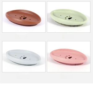 Macro detail of soft silicone pet grooming brush with dense bristles in four nordic colors