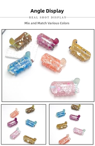 Detailed view of colorful acrylic boot hair clips with star and leaf patterns