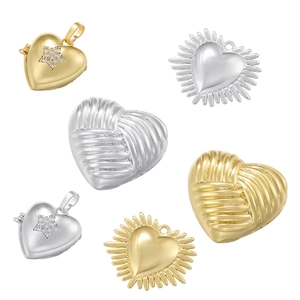 Detailed grid of vintage heart pendants in gold and silver with various textures
