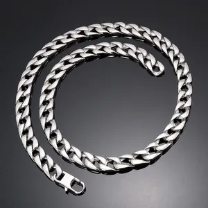 Polished silver cuban link chain with a flat clasp on a reflective black background
