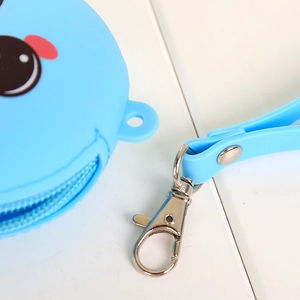 Close-up of blue silicone coin purse showing the smooth zipper and metal spring hook