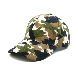 Detail view of camouflage corduroy fabric texture and stitching on the baseball cap