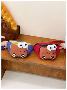Detail of children's cartoon car fanny pack showing waffle texture and cute 3D design