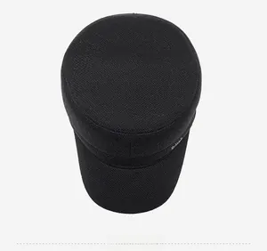 Top view of a black cadet cap with silver logo detail and textured woven fabric