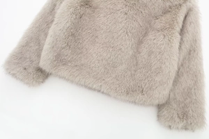 Close-up detail of plush light gray faux fur texture with dense and soft fibers