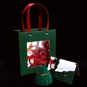Christmas gift set with green tree jewelry box, matching tote bag and festive greeting card