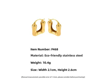 Detail view of 18k gold plated U-shaped earrings with measurements and 10.4g weight info
