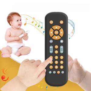 Close-up of baby remote control toy featuring multi-language buttons and music notes