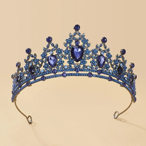 Close-up of Baroque silver alloy tiara featuring dark blue rhinestones and crystals