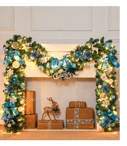 Close-up of 270cm Christmas garland with blue flowers, LED lights and Merry Christmas sign