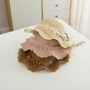 Girls straw sun hats with lace flowers and wavy brims in cream, pink and brown