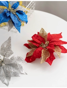 Detail of red and blue 27cm poinsettia flowers with glitter and flocking texture