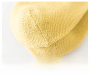 Close-up of seamless toe stitching on bright yellow cotton low cut ankle socks