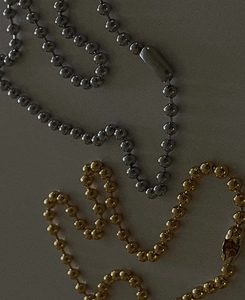 Detail of silver and gold toned 18k gold plated beaded ball chain necklaces