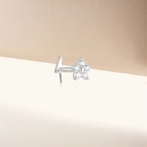 Macro view of S925 silver flower stud earring with marquise stones and lightning screw back