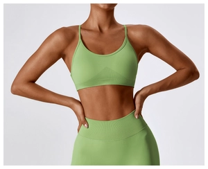 Close-up of high-waist seamless compression leggings and sports bra in matcha green